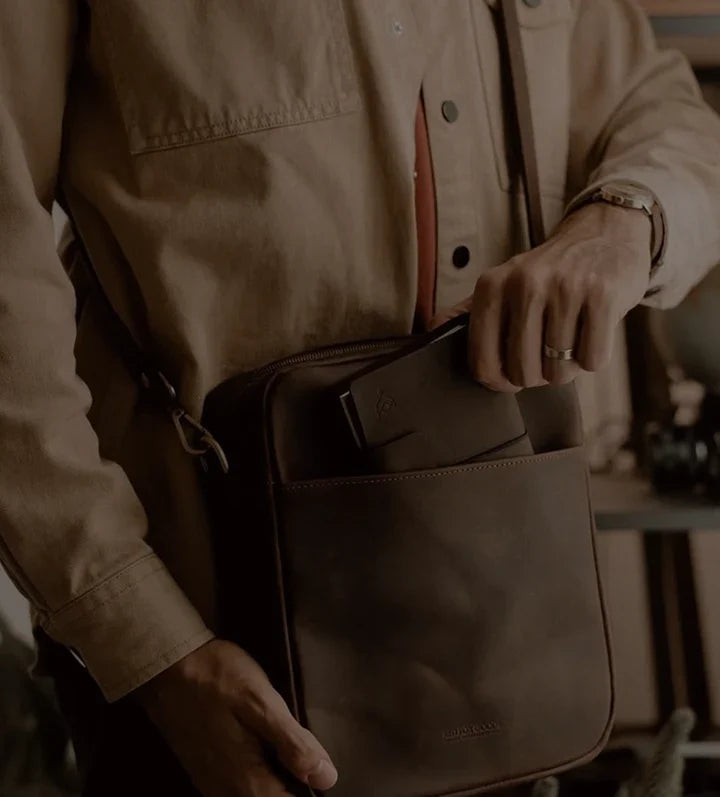 A leather holdall photographed in low light
